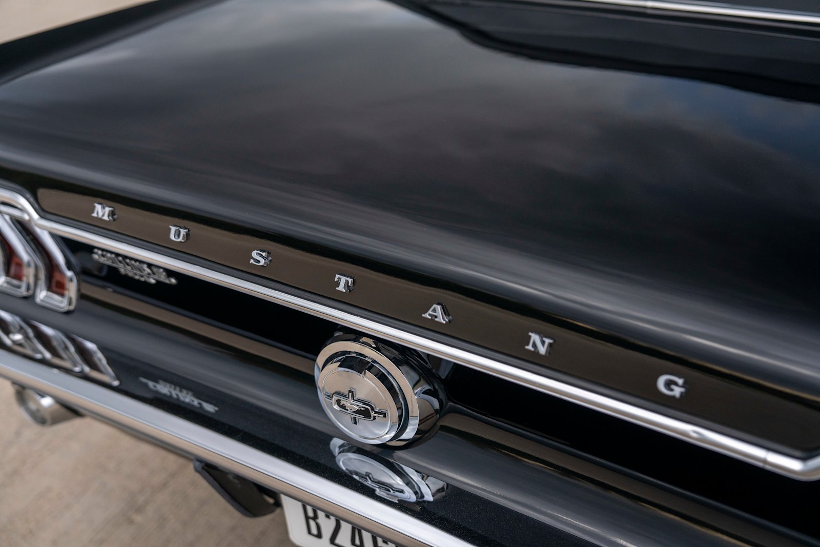 Side profile of the black Mustang convertible